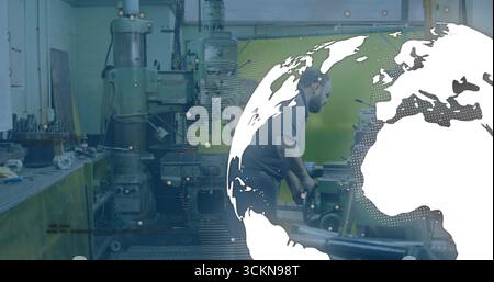 Technician wearing goggles using milling machine at fabrication shop globe graphic, copy space Stock Photo