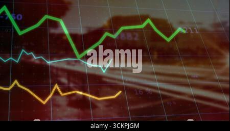 Displaying line graph overlay showing green, light blue, yellow trends on highway with grid lines Stock Photo