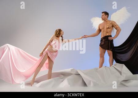 Couple poses with creative costumes in artistic expression of love Stock Photo