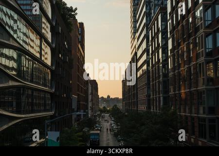 Scenic aerial Chelsea street vista at sunset in summer, taken from the High Line, Manhattan, New York City Stock Photo