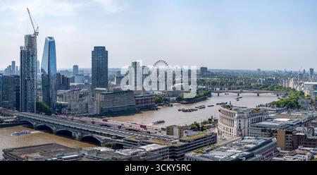 A striking view of London’s South Bank, featuring the nearly completed Opus tower and the adjacent triangular-glass skyscraper, Mandarin Oriental Bank Stock Photo