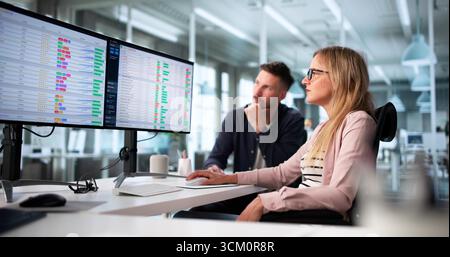 Analyzing Financial Reports On Computer As Medical Billing Audit Manager Stock Photo