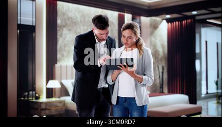 Room Inspection Training For New Hotel Staff Led By Manager. Stock Photo