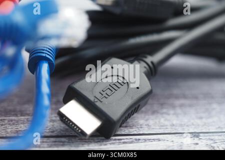 Close-up view of HDMI cables and connections on a table Stock Photo