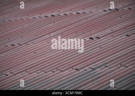 Background texture of the roof of old zinc sheet, metal roof sheet with rusty texture Stock Photo