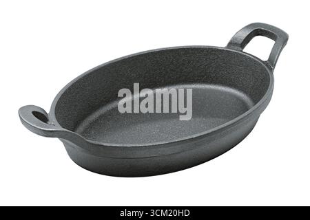 Oval cast iron frying pan, isolated on white background Stock Photo
