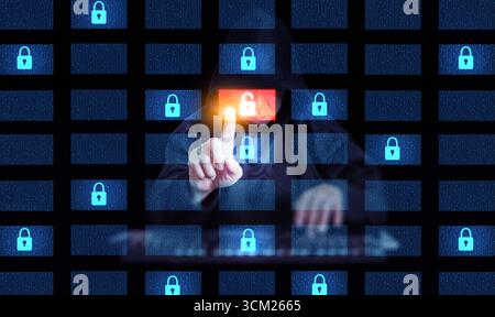 Hacker in hoodie touching digital screen with security lock icon, concept of data protection, internet hacking, cyber attack prevention, information p Stock Photo