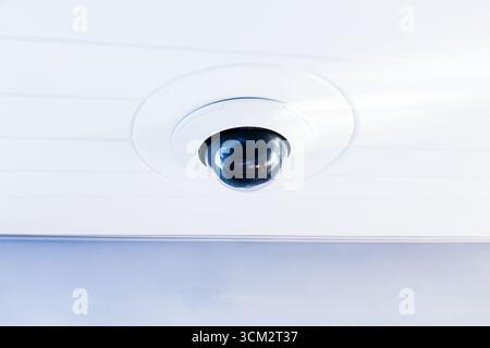 CCTV camera on the hull of an expensive motor yacht. CCTV camera white on a white body. Stock Photo