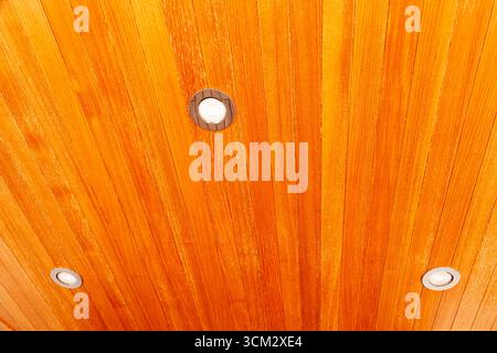 Wooden ceiling with built in ceiling spotlights. Stock Photo