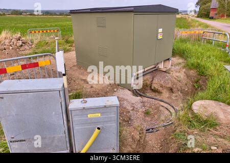 Open cable trench with power cable and house connection box Stock Photo ...