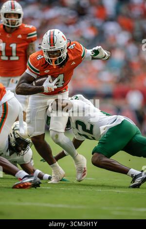 Miami Running Back Mark Fletcher Jr Right Scores A Touchdown During