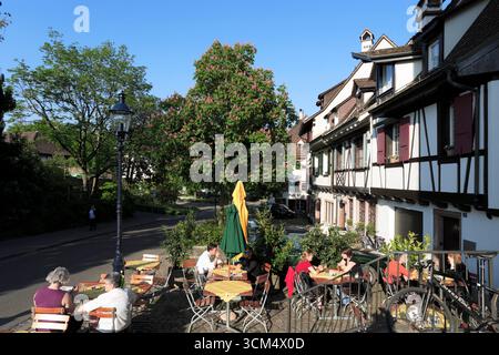 Pavement cafe near Spalenturm, former city gate in the city walls of Basel, Basel, Switzerland Stock Photo