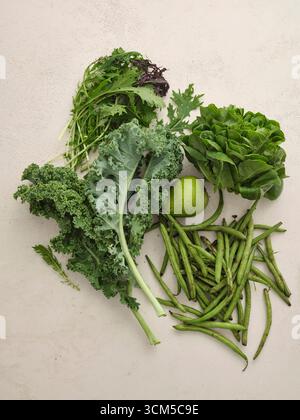 Green fruit and vegetables - pear, kale, rocket, lettuce, beans Stock Photo
