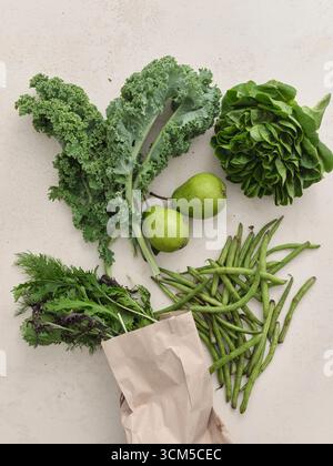 Green fruit and vegetables - pear, kale, rocket, lettuce, beans Stock Photo