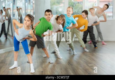 Group of children warming up before dance class Stock Photo