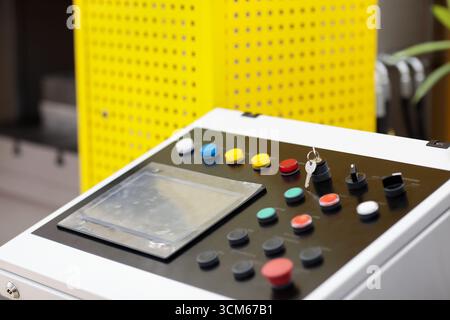 Control console of modern production equipment. Close up of industrial control console with touch screen panel. Selective focus. Stock Photo
