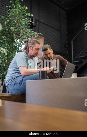 Business project team working together at meeting room at office. Programmers working in the office of a software development company. Coding Stock Photo