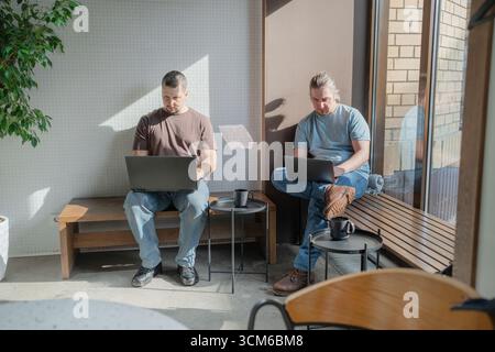Business project team working together at meeting room at office. Programmers working in the office of a software development company. Coding Stock Photo