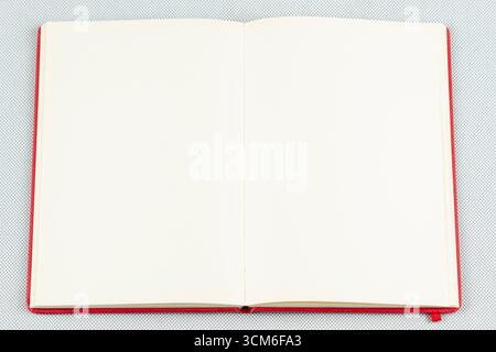 close up to a red blanked notebook over a white background Stock Photo