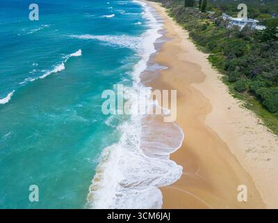 Aerial view of waves patterns on a long sandy beach at Currimundi on the Sunshine Coast in Queensland, Australia. Stock Photo