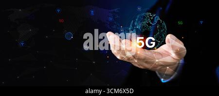 Close up of business hand holding glowing 5G digital globe with network background. Concept of high speed internet, smart technology, innovation, wire Stock Photo