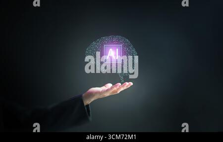 Modern artificial intelligence brain hologram glowing above hand, symbolizing innovation, deep learning, data science, and advanced digital technology Stock Photo