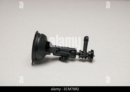 A black suction cup mount with adjustable arm, designed for cameras or devices Stock Photo