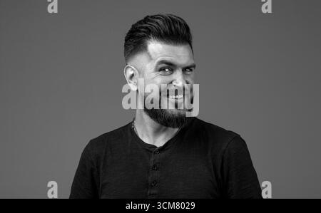 Closeup profile side view portrait of his he nice attractive content brown-haired cheerful cheery guy modern look. Bearded man, stylish hairstyle Stock Photo