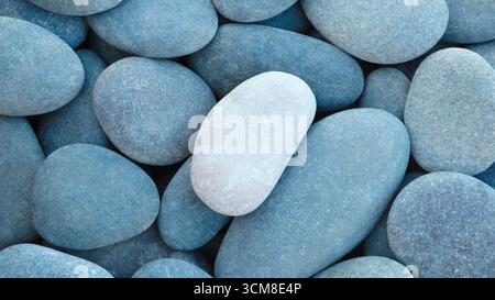 Pebbles stones on seashore as  texture background for design web banner template page. many stones and they are different in color and size, dry stone Stock Photo