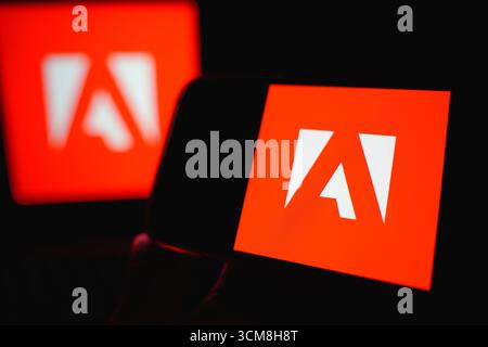 Roosendaal, The Netherlands - September 14, 2025: Smartphone displaying Adobe Inc corporate branding on screen. Stock Photo