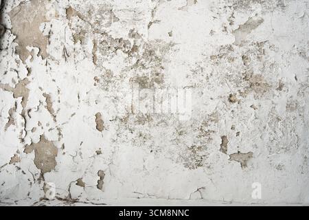 Gray concrete wall with peeling white color Stock Photo