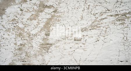 Gray concrete wall with peeling white color Stock Photo