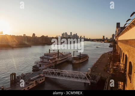 England, London, Southwark, Butlers Wharf and Sunrise over the River Thames Stock Photo