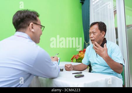 An Engaging Conversation Between Two Thoughtful Individuals at a Table Stock Photo