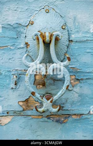 Old turquoise door knocker in the old town of Rethymno, Europe, Crete, Greece, Rethymno, GR, Travel, Tourism, Destination, Sightseeing Stock Photo