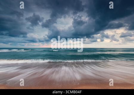 Dramatic Ocean Seascape with Waves Under a Stormy Cloudy Sky Stock Photo