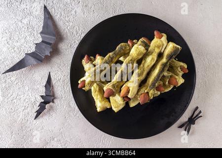 Halloween green finger cookies made from dough and matcha Stock Photo