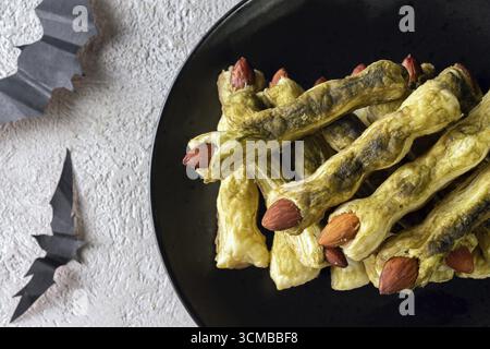 Halloween green finger cookies made from dough and matcha close up Stock Photo