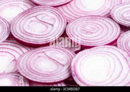 Sliced red onion on white background, top view, close up Stock Photo