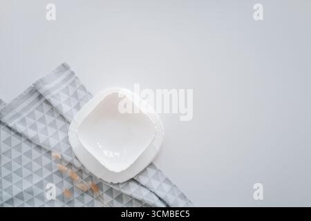 Set of stylish tableware set flat lay top view on white background. Stock Photo