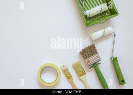 Top view wall painting tools on white background. Stock Photo