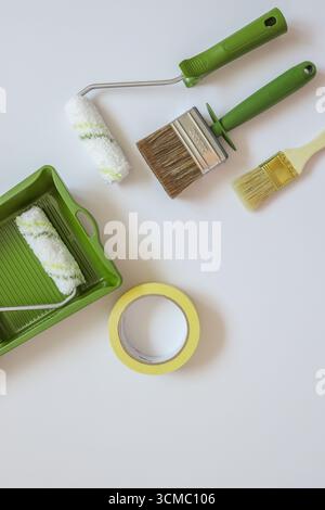 Top view wall painting tools on white background. Stock Photo