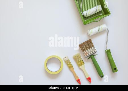 Top view wall painting tools on white background. Stock Photo