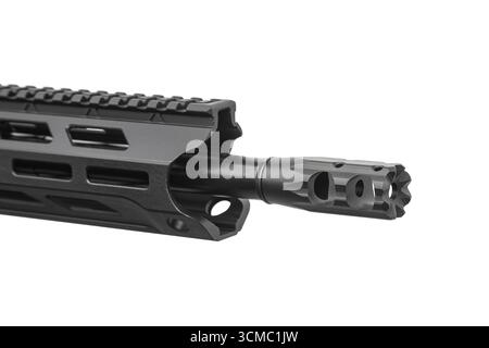 A close-up shot of the muzzle and handguard of a black tactical rifle. Stock Photo