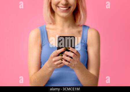 Mobile communication. Unrecognizable woman holding smartphone, b Stock Photo