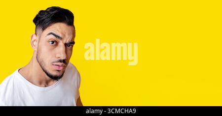 Top view of surprised arabic guy looking at camera Stock Photo