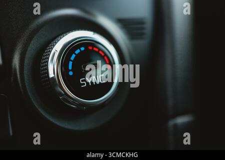 Modern car climate control panel for driver and passenger with shallow depth of field. Zone climate control. Car interior detail. Stock Photo