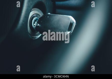 Ignition key of modern car close up. Car key in keyhole. Stock Photo