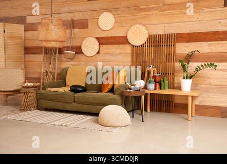 Interior of living room with glucophone on sofa and tables Stock Photo