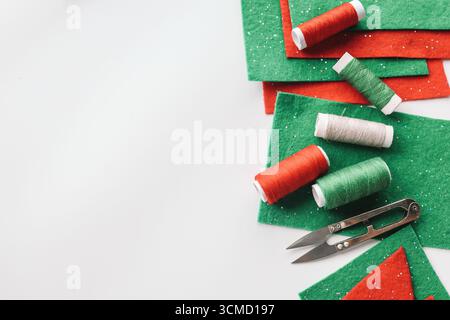 Composition with threads and sewing accessories on white background. Stock Photo
